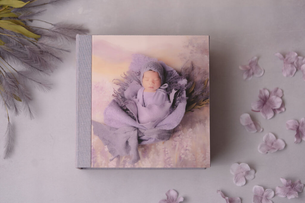 Photo of heirloom newborn album by SteinArtStudio