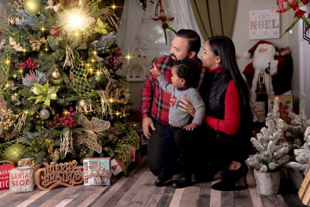 Christmas themed family portrait of a family and their son
